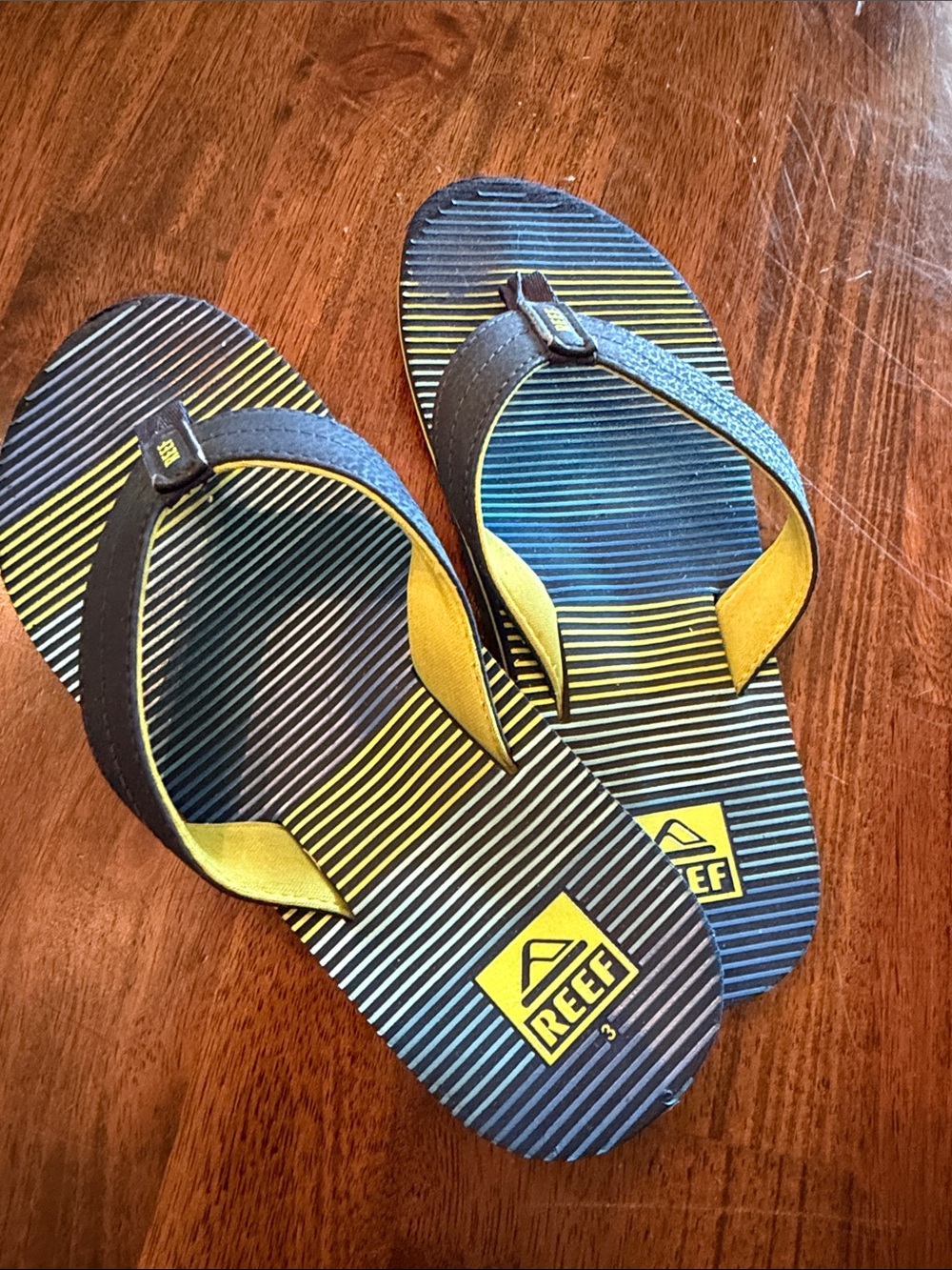 Reef Boy’s Striped Flip Flops in Blue, Yellow/Green, Size 3